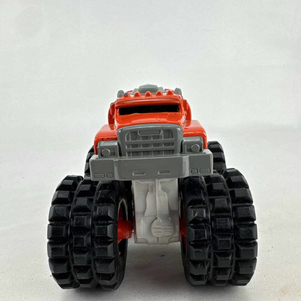 Tonka monster truck 8-wheel dually fuel tanker diecast vehicle in bright orange with flame graphics