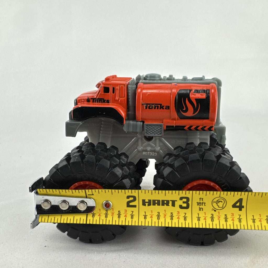 Tonka monster truck 8-wheel dually fuel tanker diecast vehicle in bright orange with flame graphics