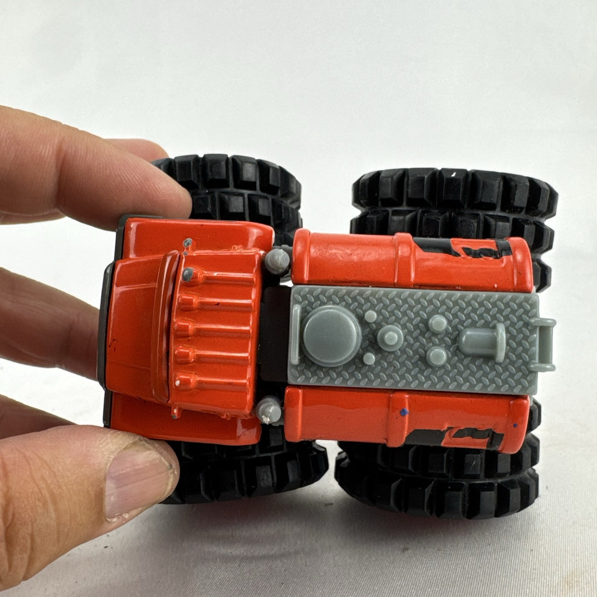 Tonka monster truck 8-wheel dually fuel tanker diecast vehicle in bright orange with flame graphics