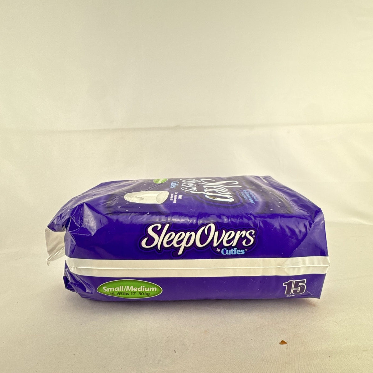 Factory sealed package of Cuties SleepOvers unisex youth overnight pants in size small medium 15 count