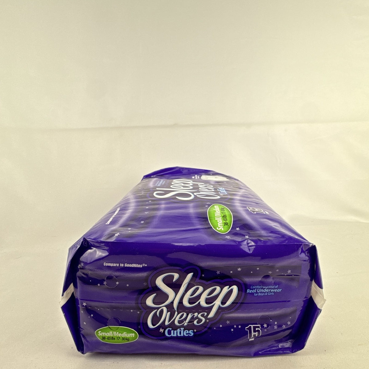 Factory sealed package of Cuties SleepOvers unisex youth overnight pants in size small medium 15 count