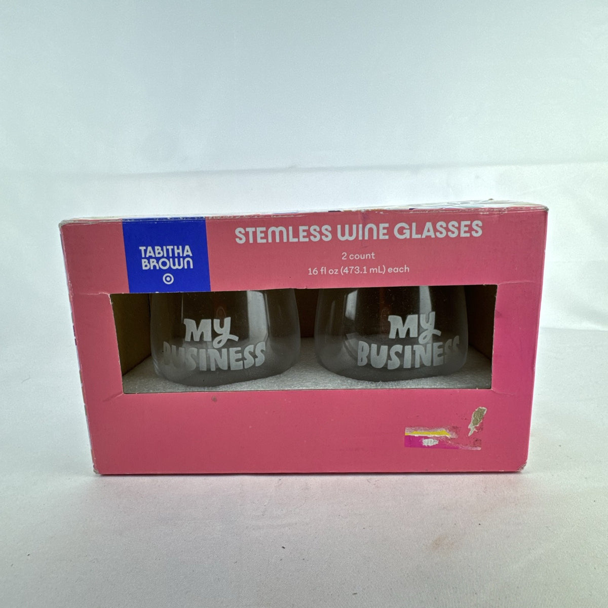 Set of two Tabitha Brown for Target clear stemless wine glasses with white My Business graphic in original box.