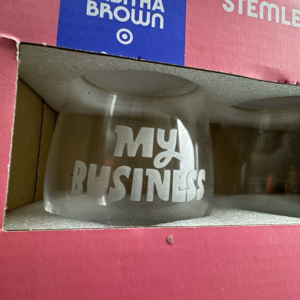 Set of two Tabitha Brown for Target clear stemless wine glasses with white My Business graphic in original box.