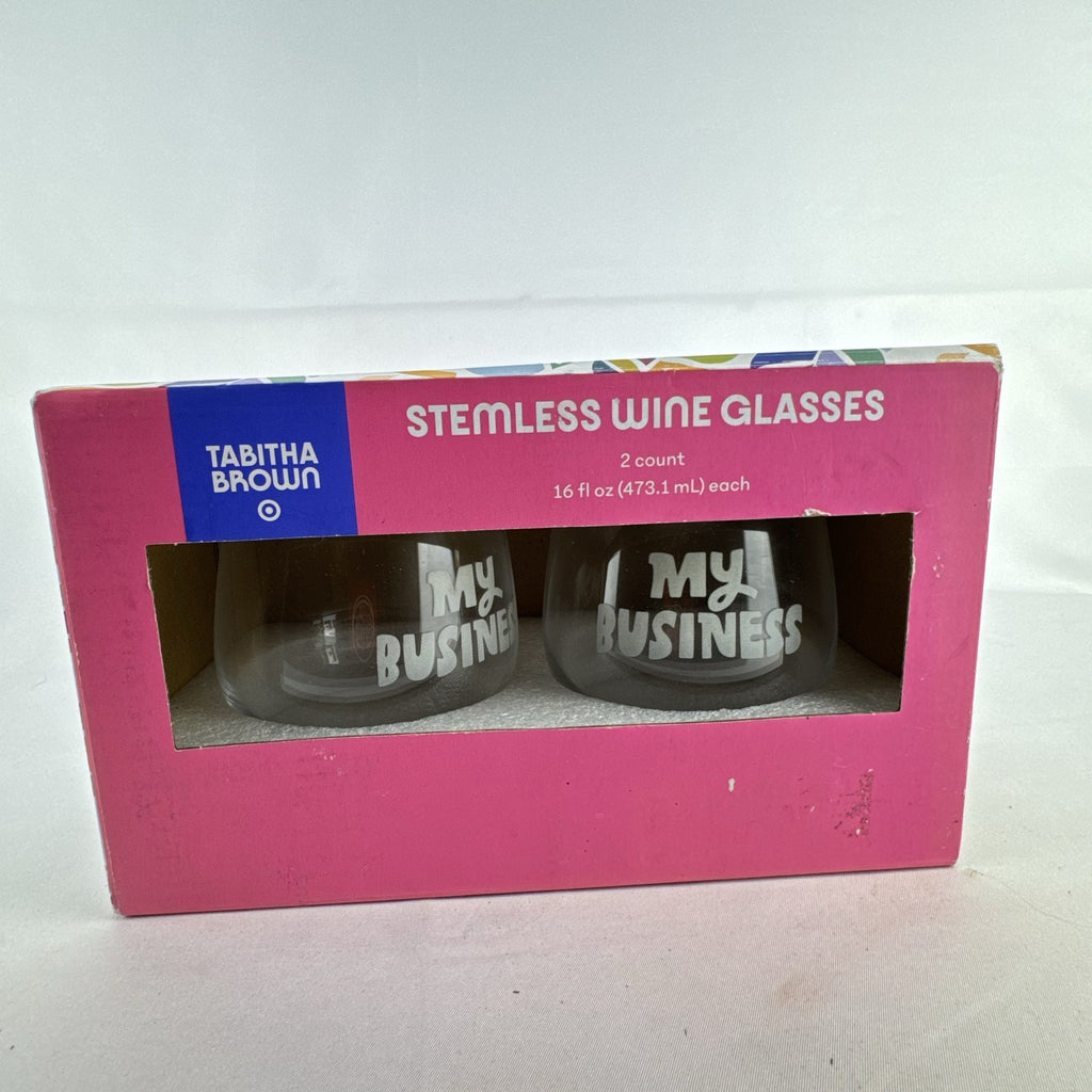 Pair of Tabitha Brown for Target clear stemless wine glasses with gold rims and etched My Business lettering