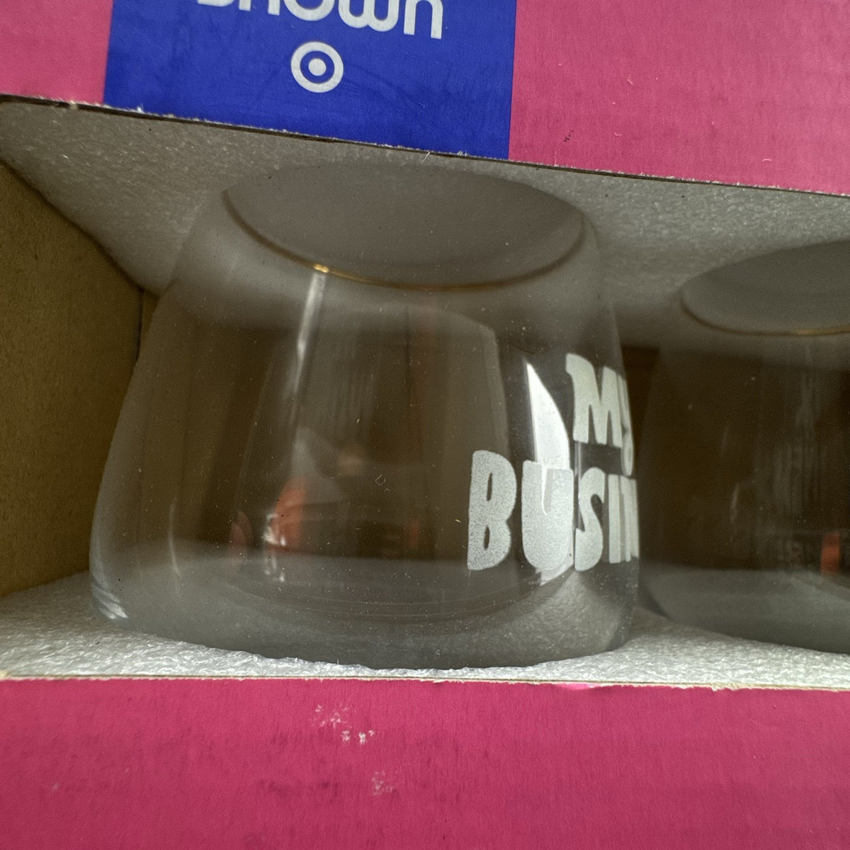 Pair of Tabitha Brown for Target clear stemless wine glasses with gold rims and etched My Business lettering