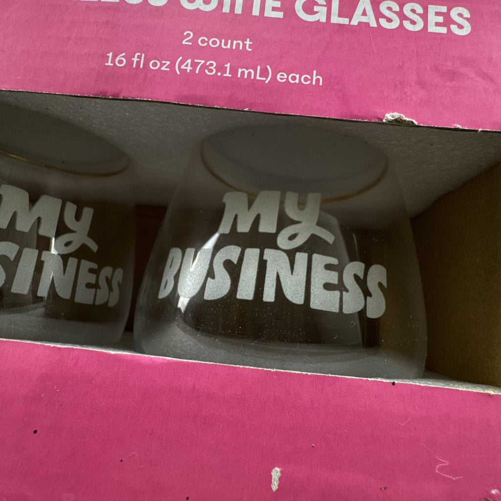 Pair of Tabitha Brown for Target clear stemless wine glasses with gold rims and etched My Business lettering