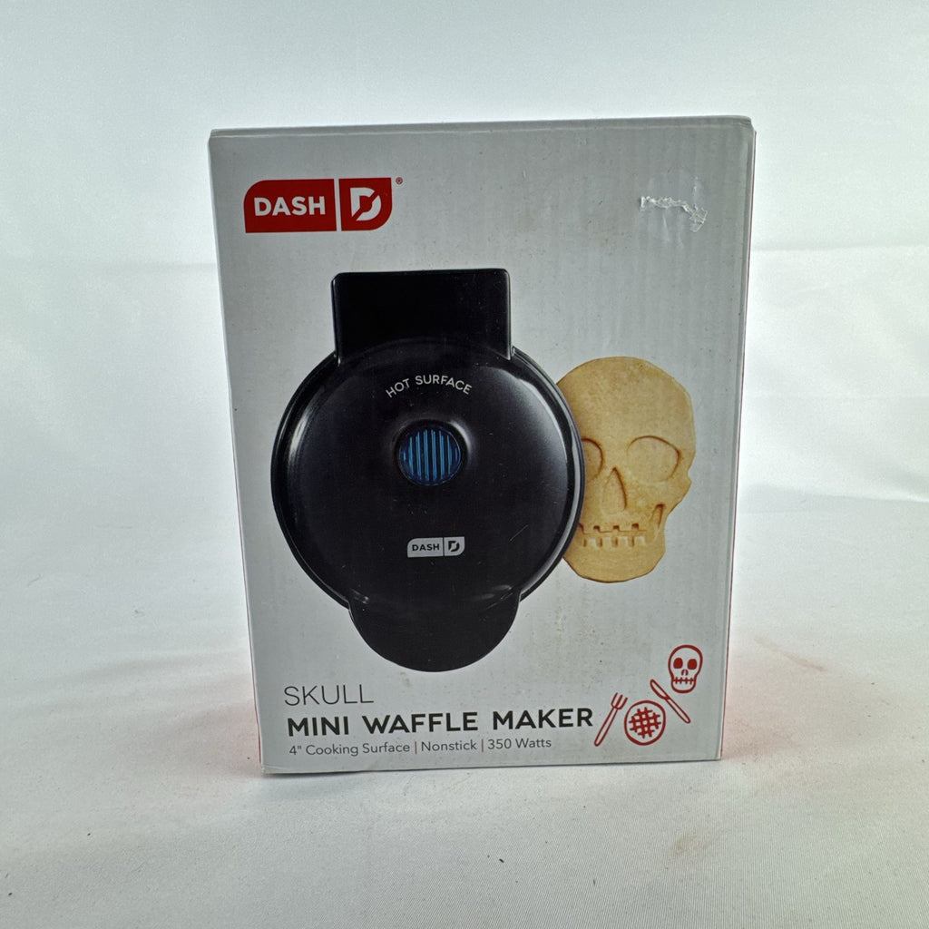 Dash 4-inch black skull mini waffle maker shown with original packaging.