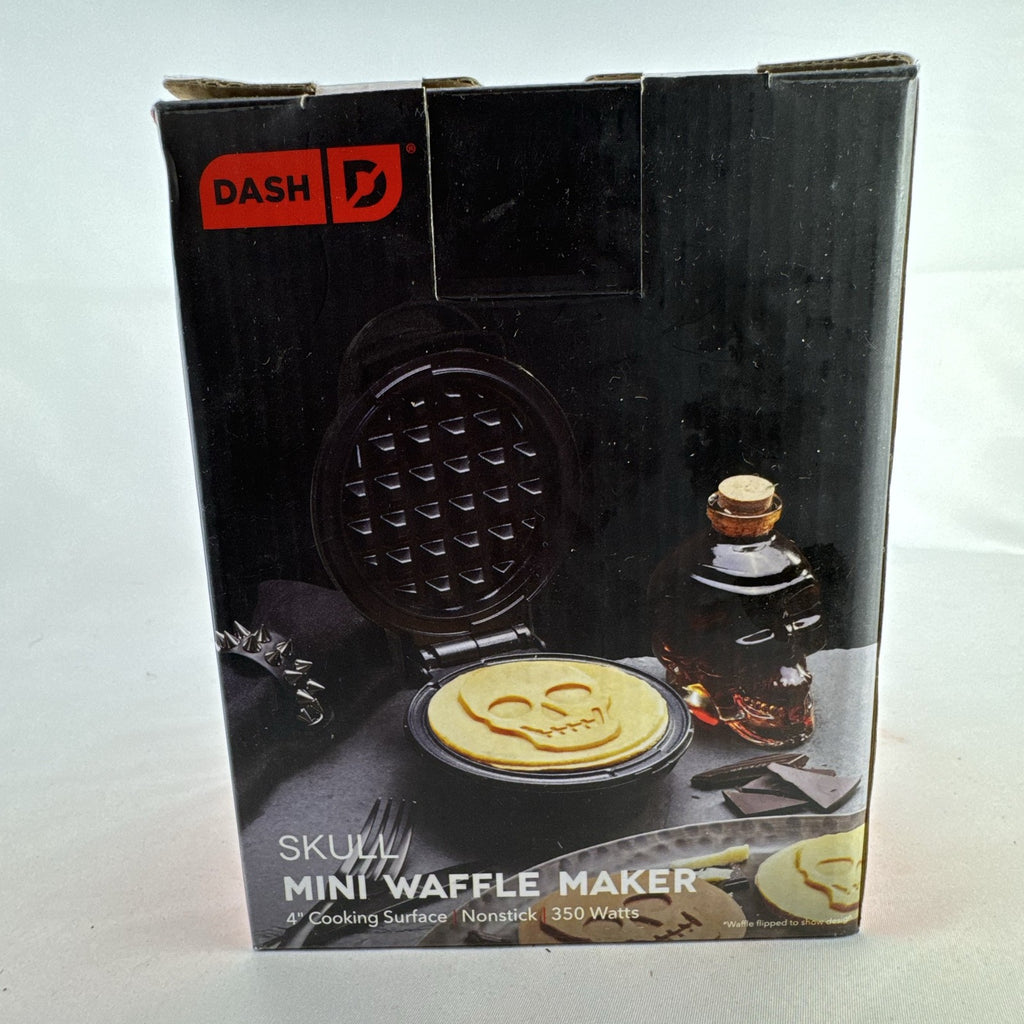 Dash 4-inch black skull mini waffle maker shown with original packaging.