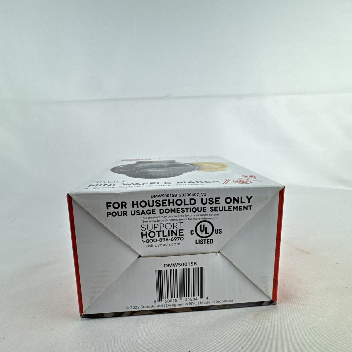 Dash 4-inch black skull mini waffle maker shown with original packaging.