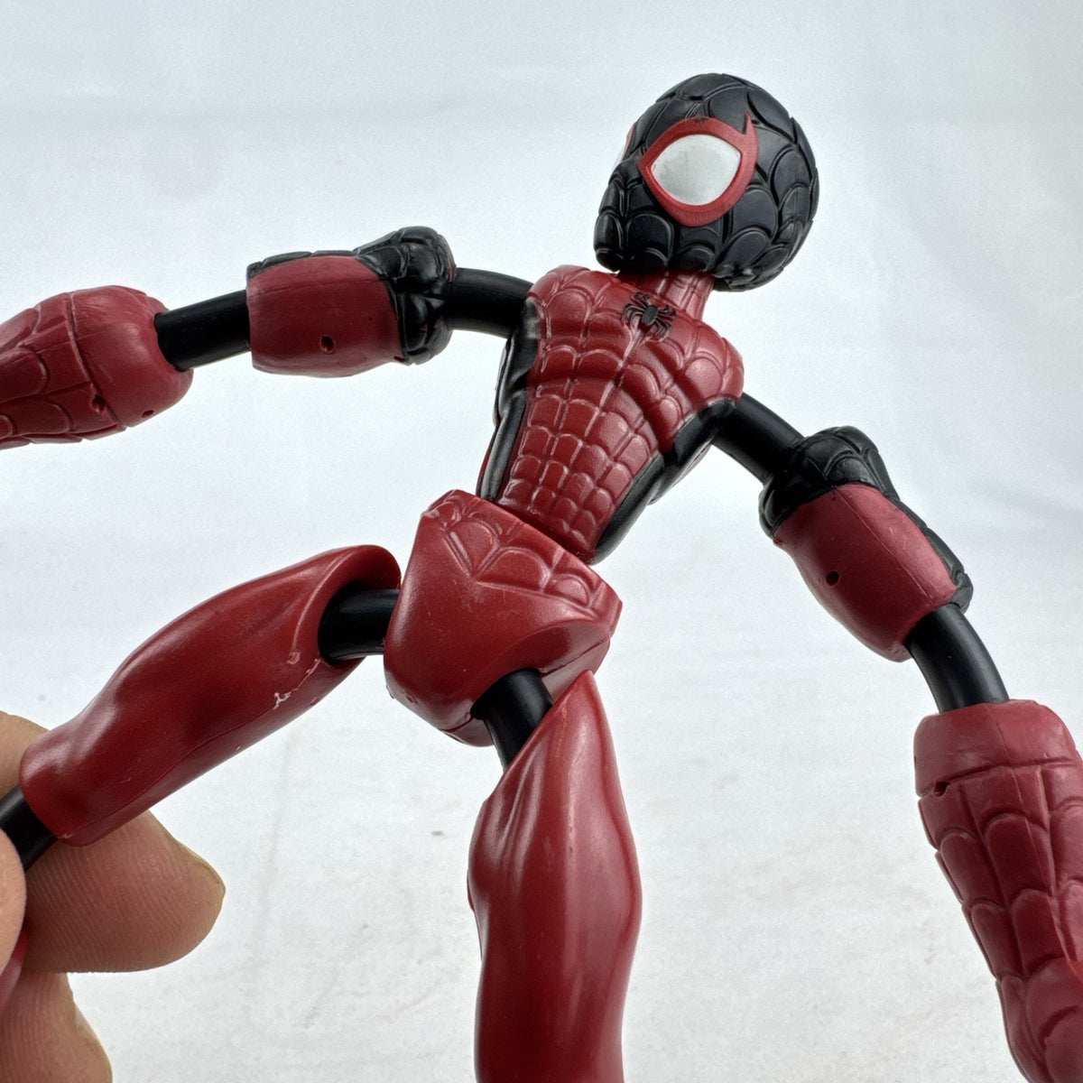 Hasbro Marvel Bend and Flex Miles Morales 6-inch bendable action figure in red and black suit.