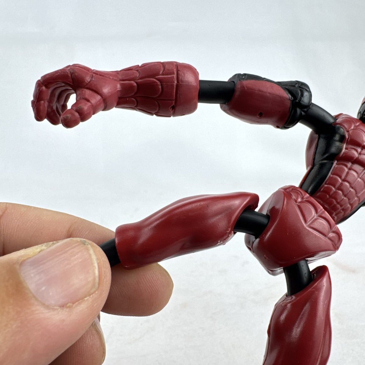 Hasbro Marvel Bend and Flex Miles Morales 6-inch bendable action figure in red and black suit.