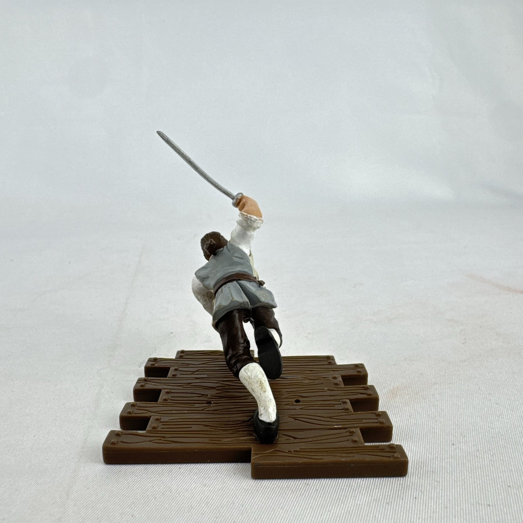 Disney Pirates of the Caribbean Will Turner mini PVC figure with cutlass on wooden dock base