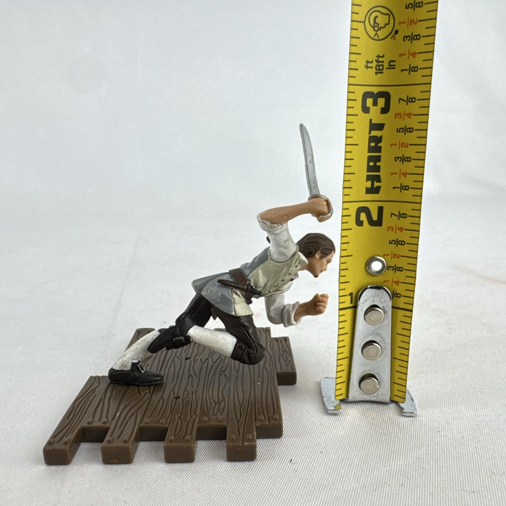 Disney Pirates of the Caribbean Will Turner mini PVC figure with cutlass on wooden dock base