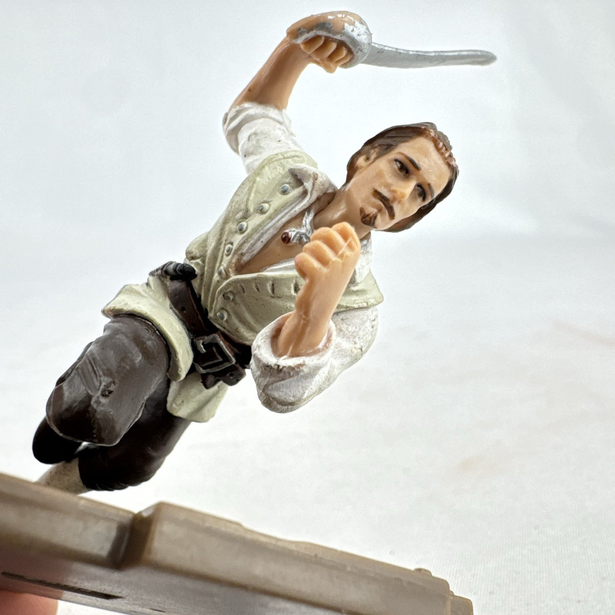 Disney Pirates of the Caribbean Will Turner mini PVC figure with cutlass on wooden dock base