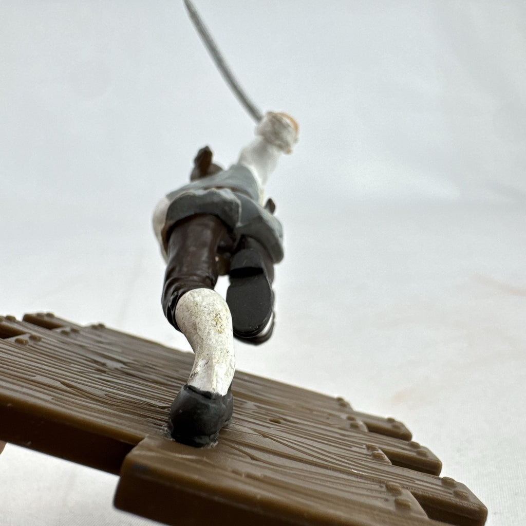 Disney Pirates of the Caribbean Will Turner mini PVC figure with cutlass on wooden dock base