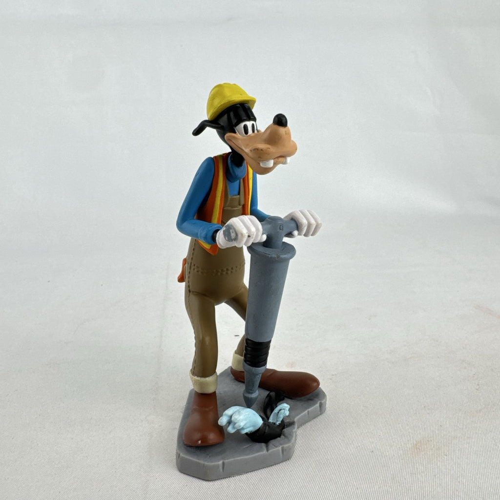 Disney Goofy construction worker PVC figurine holding a jackhammer and wearing a hard hat