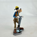 Disney Goofy construction worker PVC figurine holding a jackhammer and wearing a hard hat