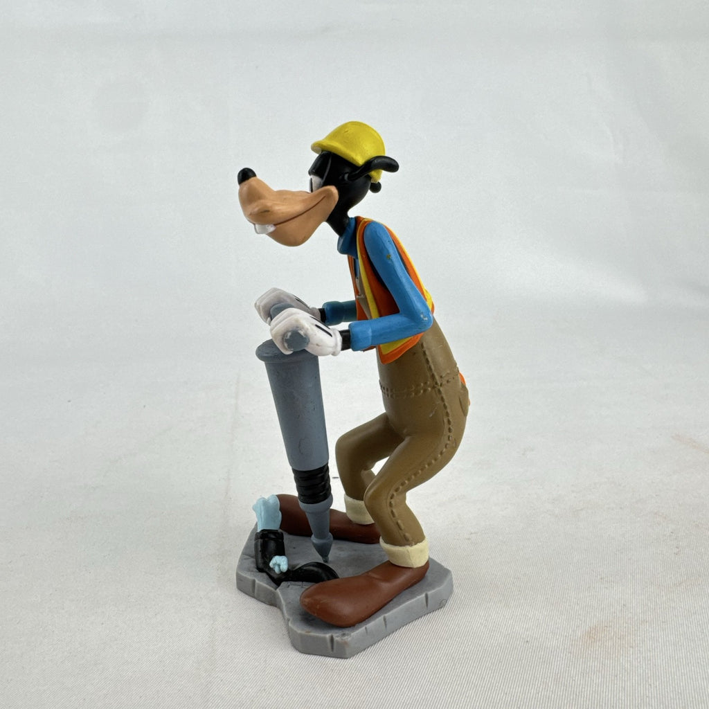 Disney Goofy construction worker PVC figurine holding a jackhammer and wearing a hard hat