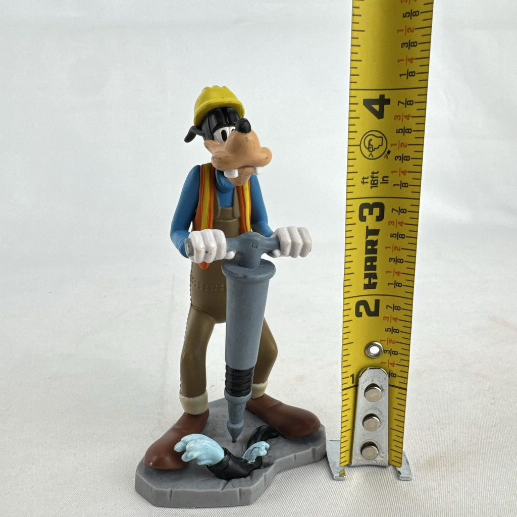 Disney Goofy construction worker PVC figurine holding a jackhammer and wearing a hard hat
