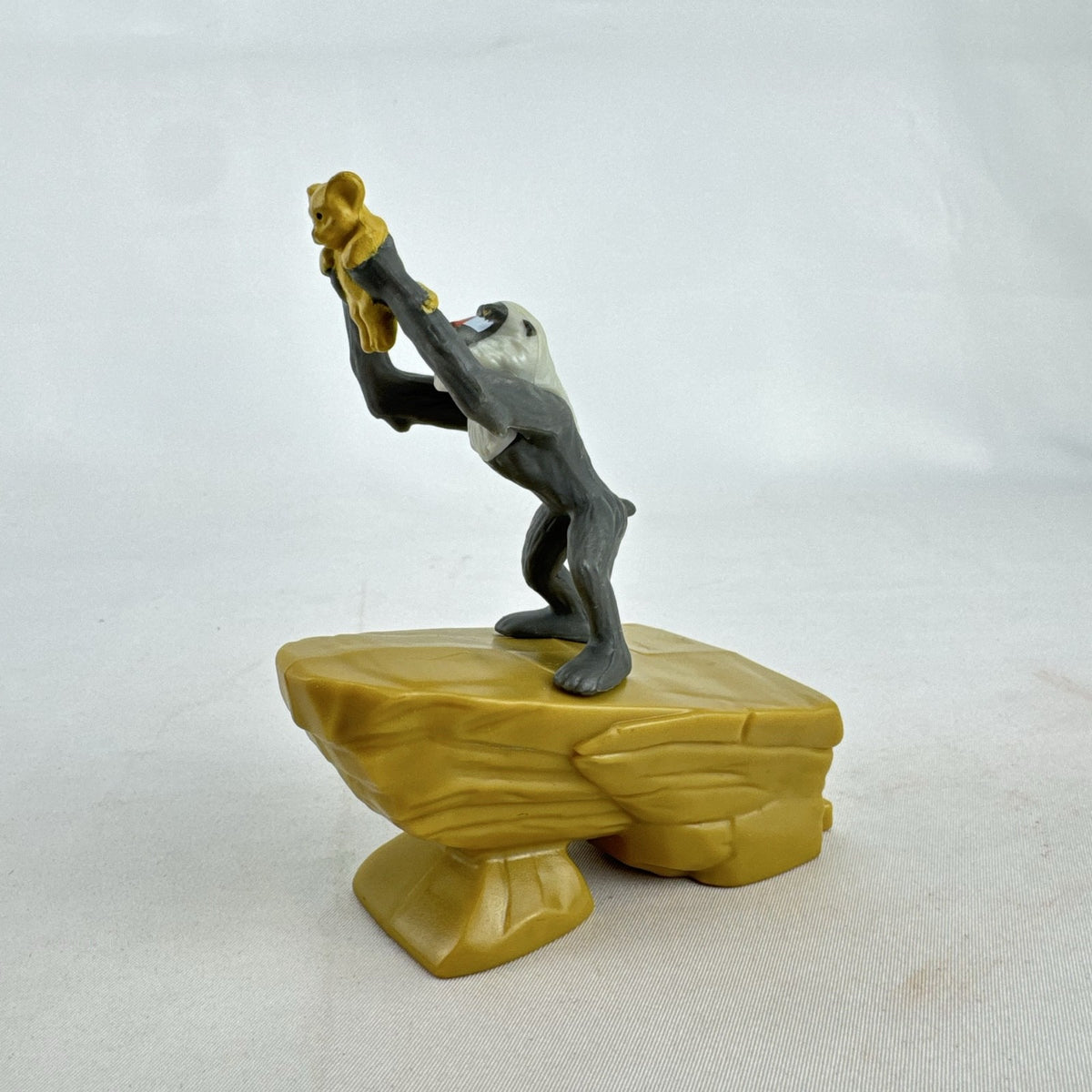 Disney Lion King 2019 McDonald's Happy Meal figure of Rafiki holding baby Simba atop Pride Rock