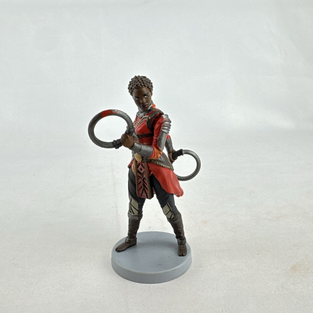 Disney Marvel Black Panther Nakia 3.5-inch PVC figurine holding dual ring blades on display base