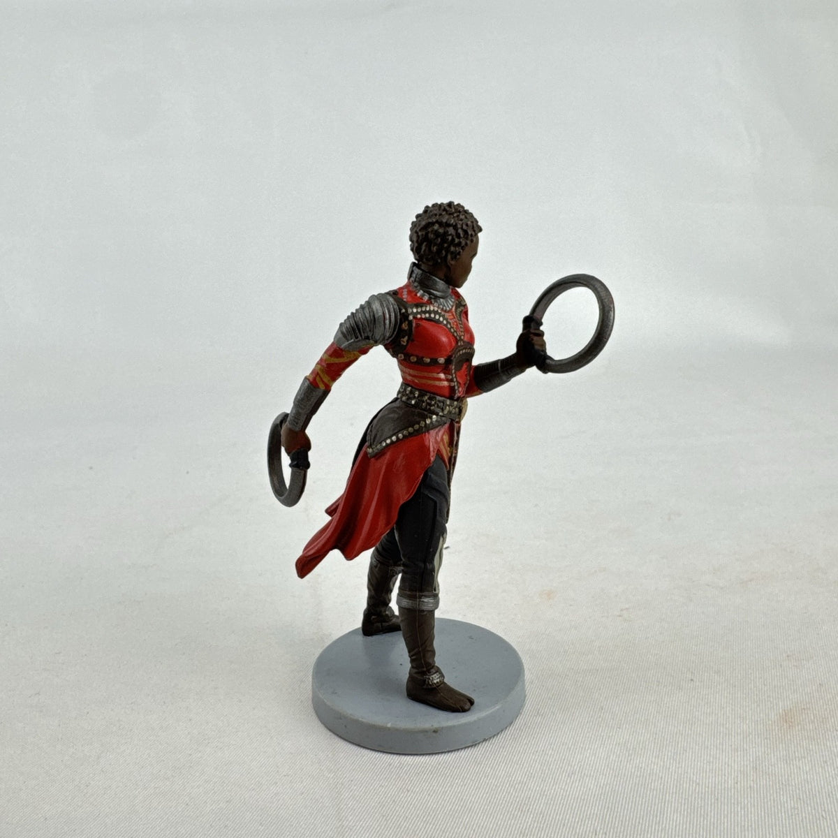 Disney Marvel Black Panther Nakia 3.5-inch PVC figurine holding dual ring blades on display base