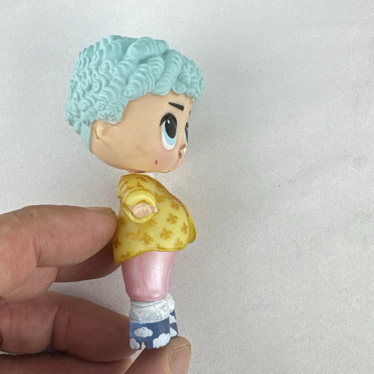 MGA L.O.L. Surprise! Boys Series 1 His Royal Highness 3-inch doll with turquoise curls and gold jacket