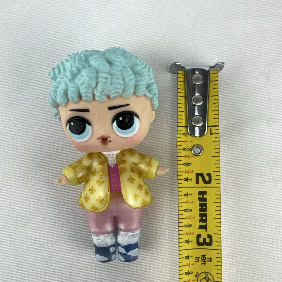 MGA L.O.L. Surprise! Boys Series 1 His Royal Highness 3-inch doll with turquoise curls and gold jacket