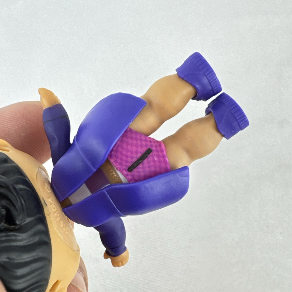 MGA Entertainment L.O.L. Surprise! 3-inch vinyl doll wearing a purple tuxedo suit and red cap