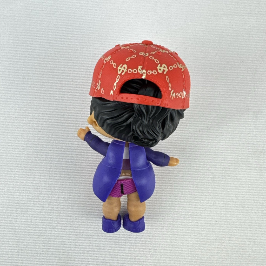 MGA Entertainment L.O.L. Surprise! 3-inch vinyl doll wearing a purple tuxedo suit and red cap