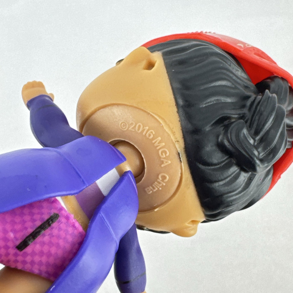 MGA Entertainment L.O.L. Surprise! 3-inch vinyl doll wearing a purple tuxedo suit and red cap