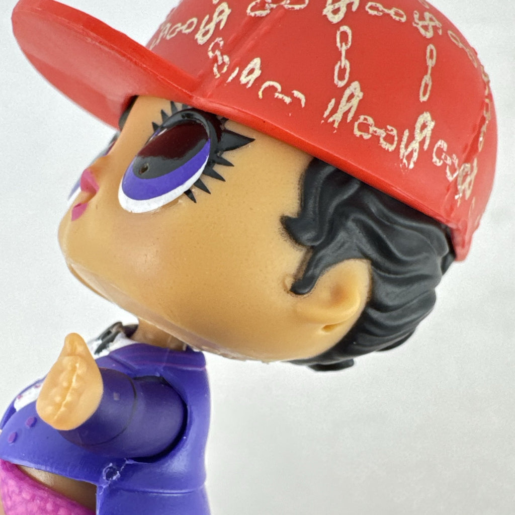MGA Entertainment L.O.L. Surprise! 3-inch vinyl doll wearing a purple tuxedo suit and red cap