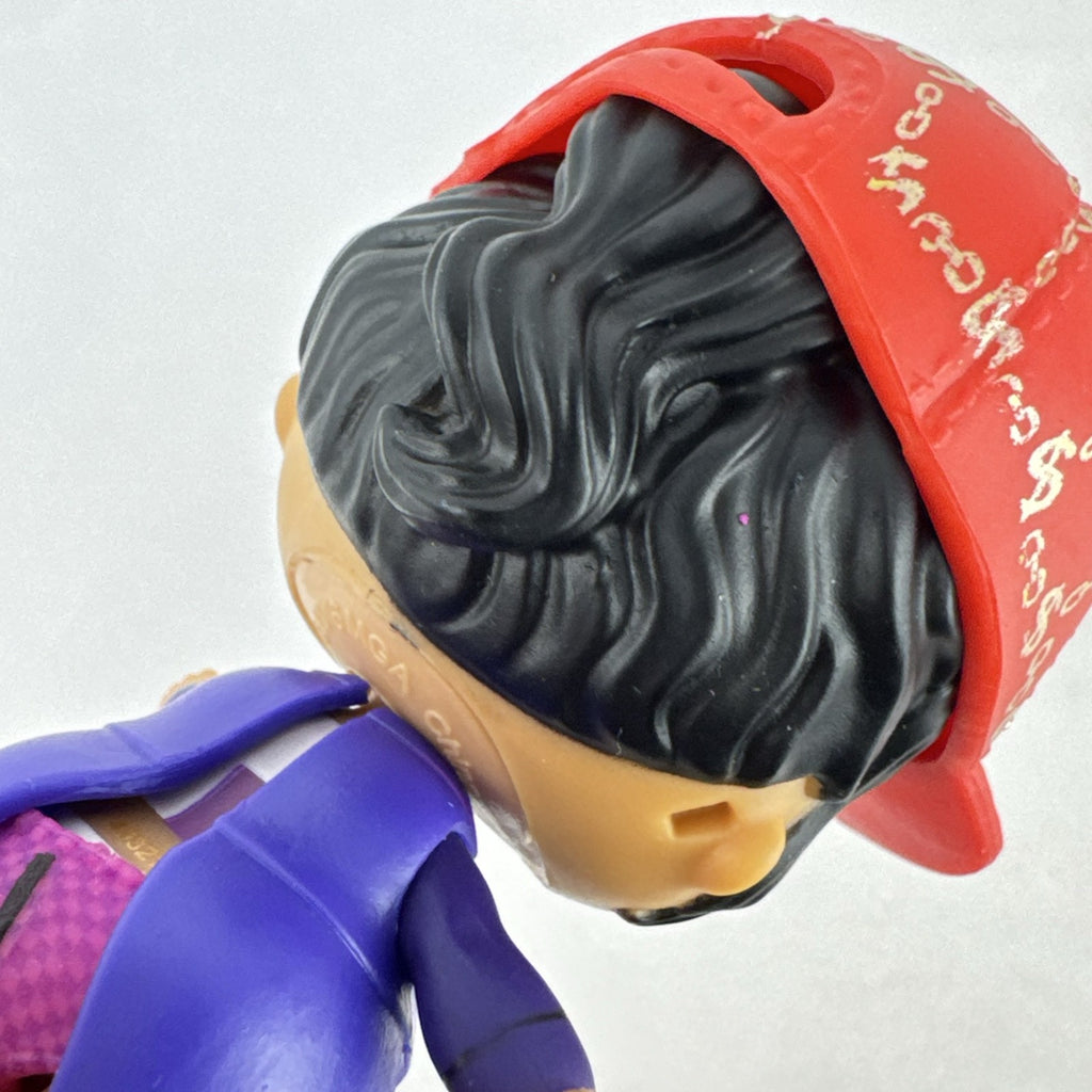 MGA Entertainment L.O.L. Surprise! 3-inch vinyl doll wearing a purple tuxedo suit and red cap