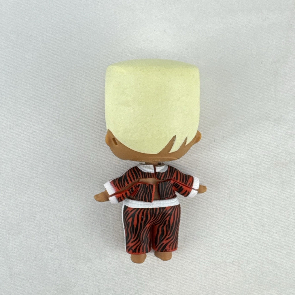 MGA L.O.L. Surprise Boys Swaggy 3-inch mini doll with blonde flocked hair and red tracksuit.