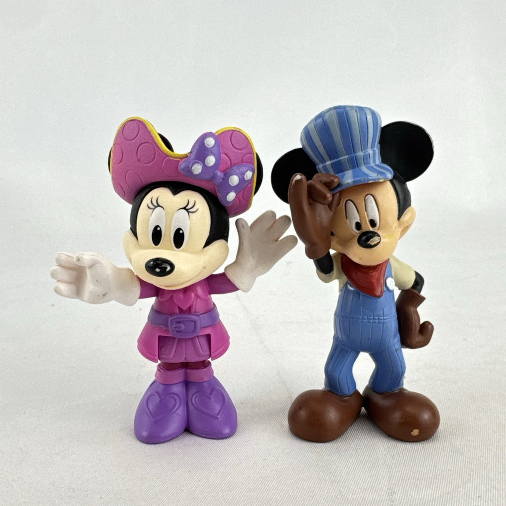 Disney 3-inch molded plastic Mickey Mouse train conductor and Minnie Mouse pirate action figures