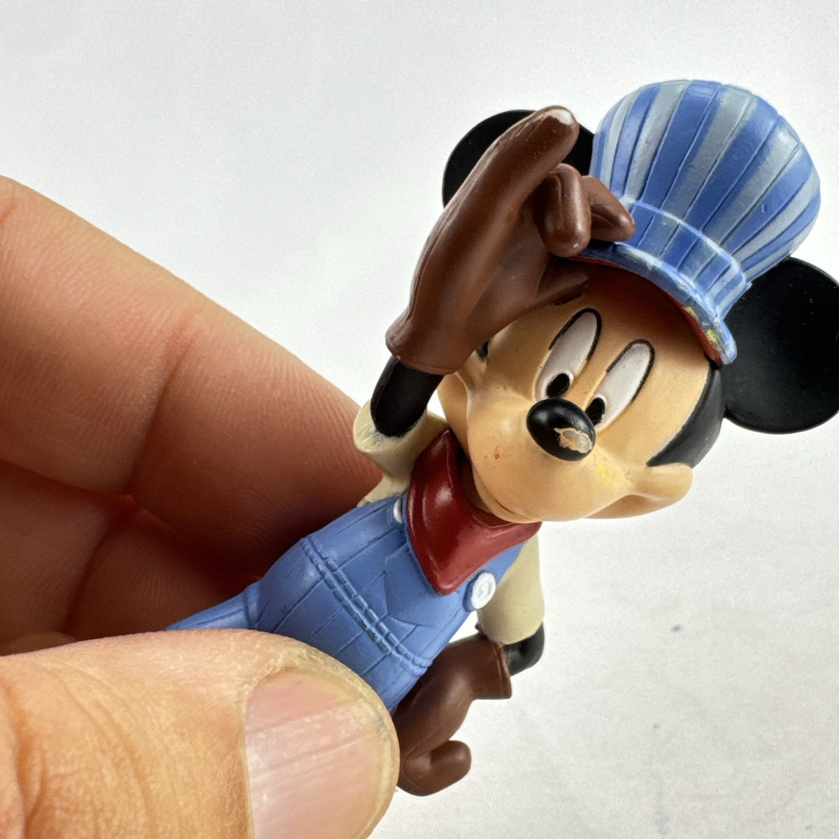 Disney 3-inch molded plastic Mickey Mouse train conductor and Minnie Mouse pirate action figures