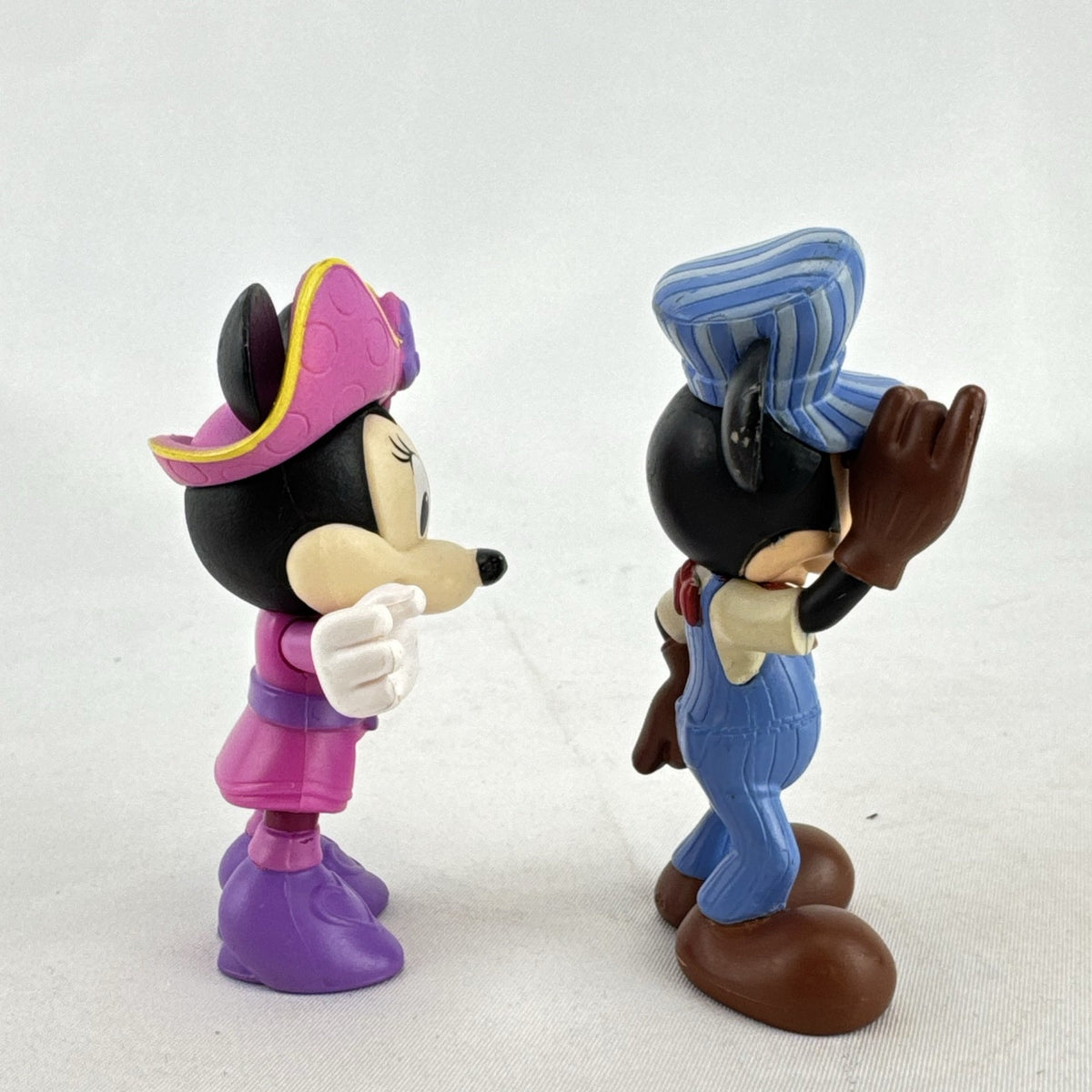 Disney 3-inch molded plastic Mickey Mouse train conductor and Minnie Mouse pirate action figures