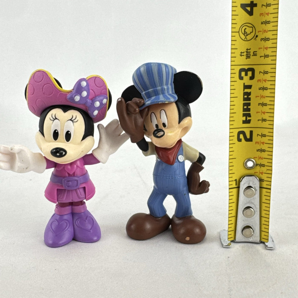 Disney 3-inch molded plastic Mickey Mouse train conductor and Minnie Mouse pirate action figures