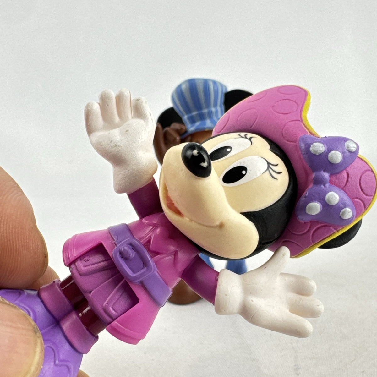 Disney 3-inch molded plastic Mickey Mouse train conductor and Minnie Mouse pirate action figures