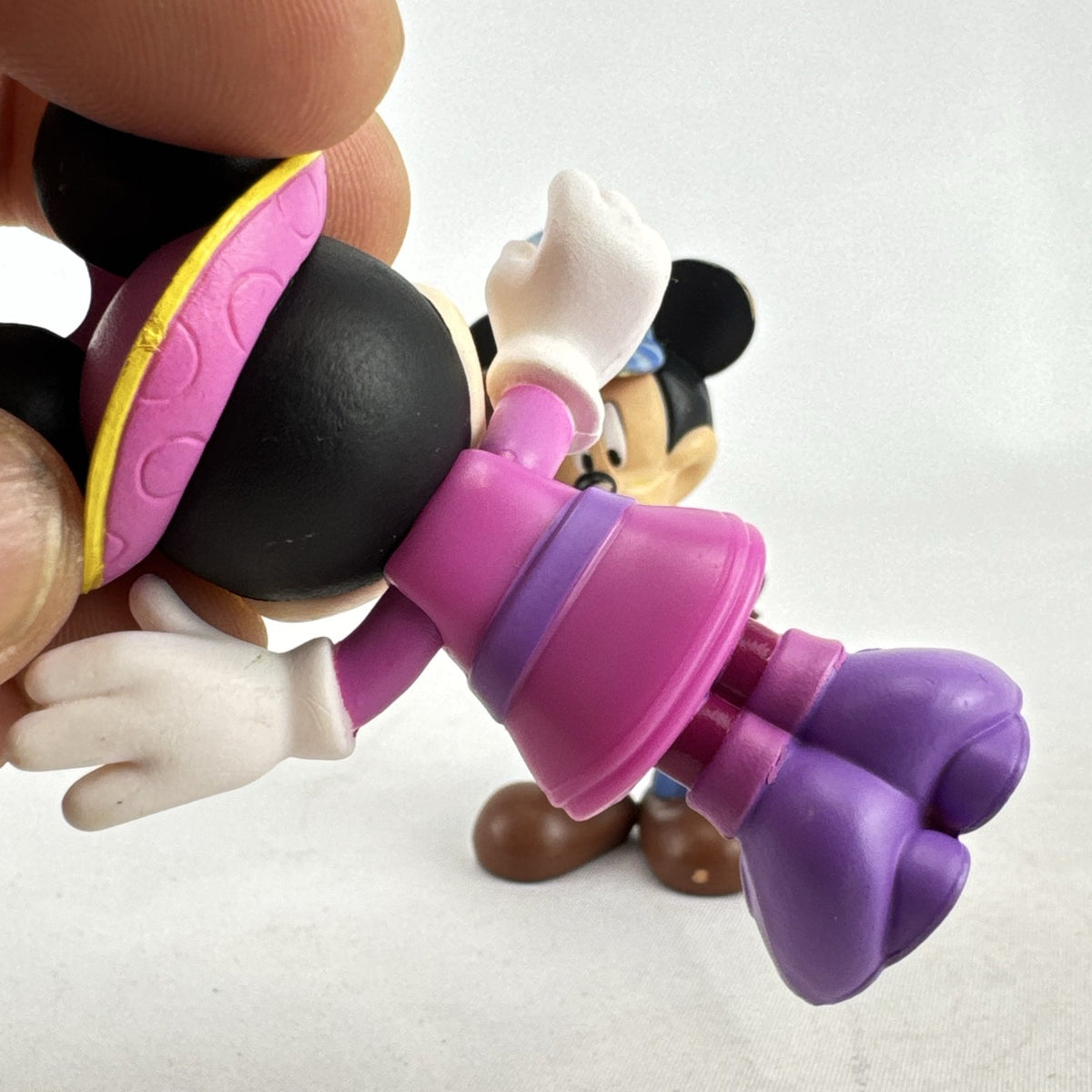 Disney 3-inch molded plastic Mickey Mouse train conductor and Minnie Mouse pirate action figures