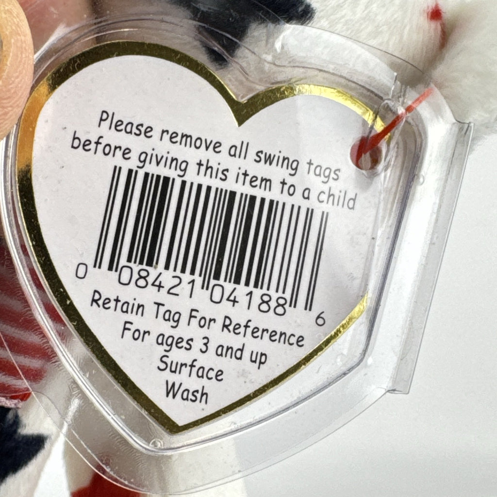 Ty Beanie Baby Glory bear plush featuring patriotic red and navy blue stars and an embroidered American flag