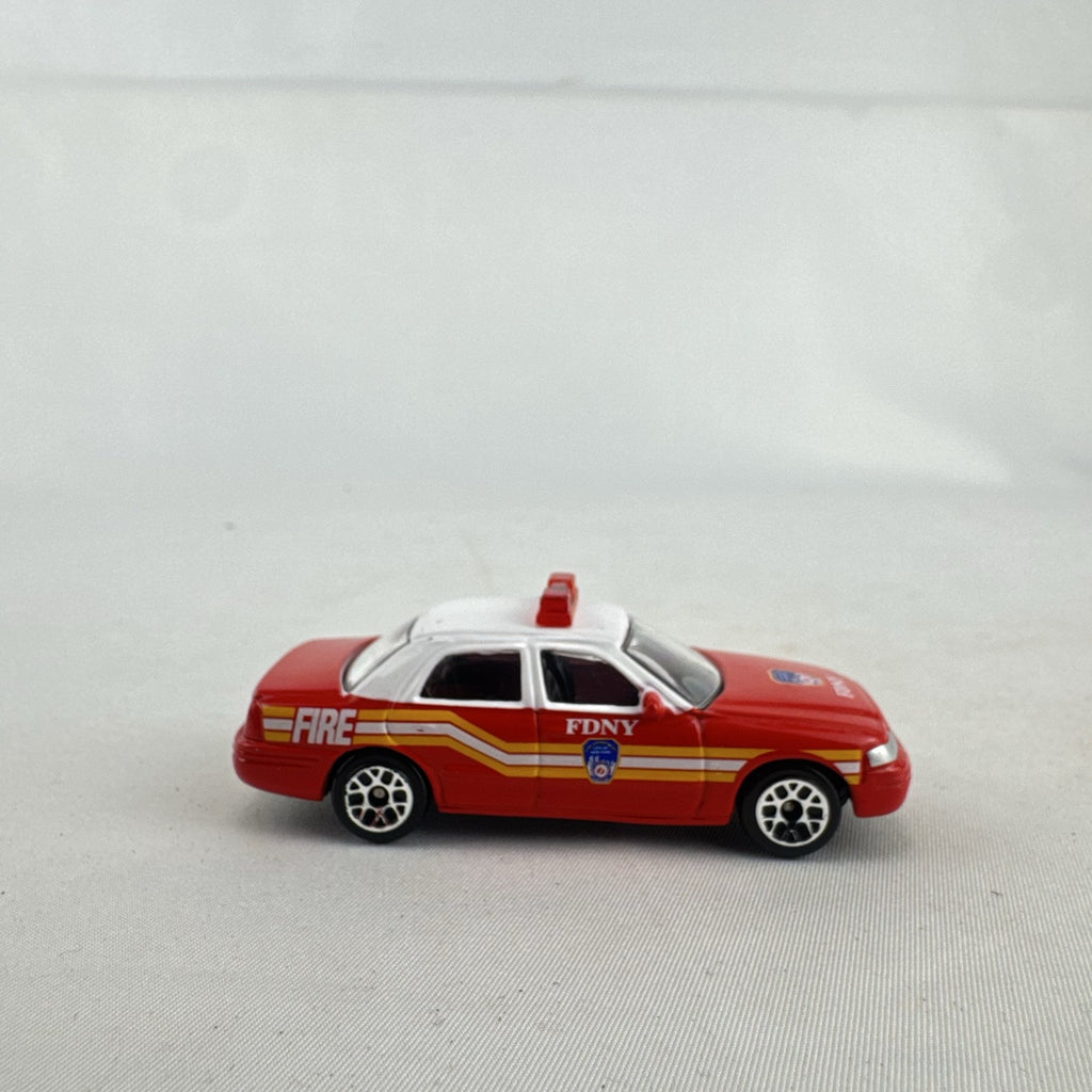 Realtoy 1:64 scale diecast Ford Crown Victoria FDNY emergency vehicle in red and white