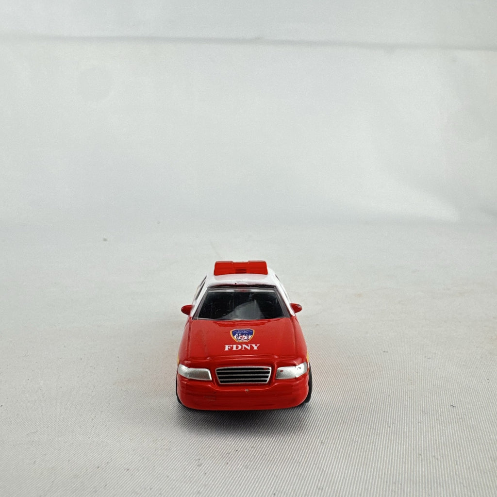 Realtoy 1:64 scale diecast Ford Crown Victoria FDNY emergency vehicle in red and white