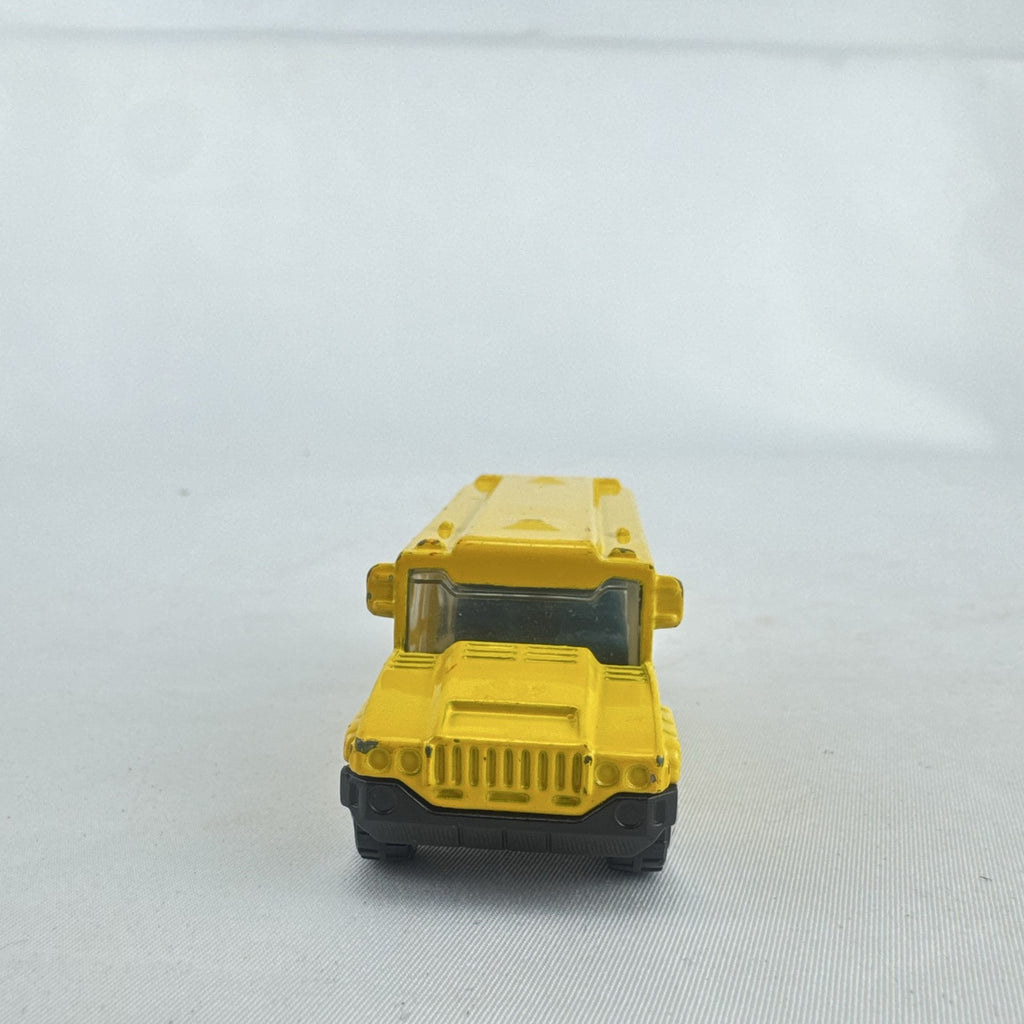 Matchbox 1:64 scale yellow diecast school bus with History dinosaur and rocket graphics