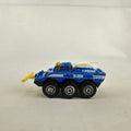 Vintage 1993 Matchbox Battering Ram blue diecast 6x6 police armored truck with rotating turret and front plow.