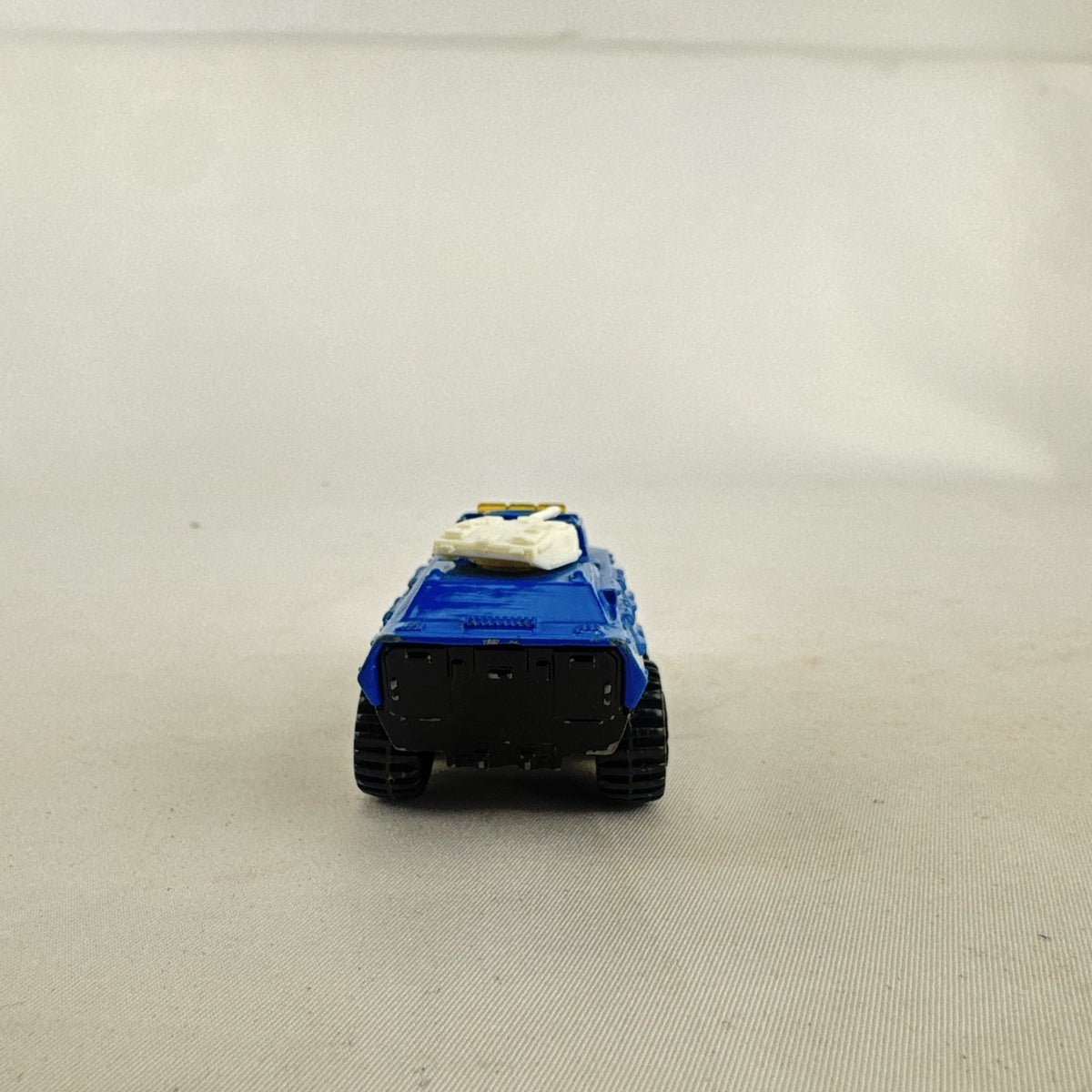 Vintage 1993 Matchbox Battering Ram blue diecast 6x6 police armored truck with rotating turret and front plow.