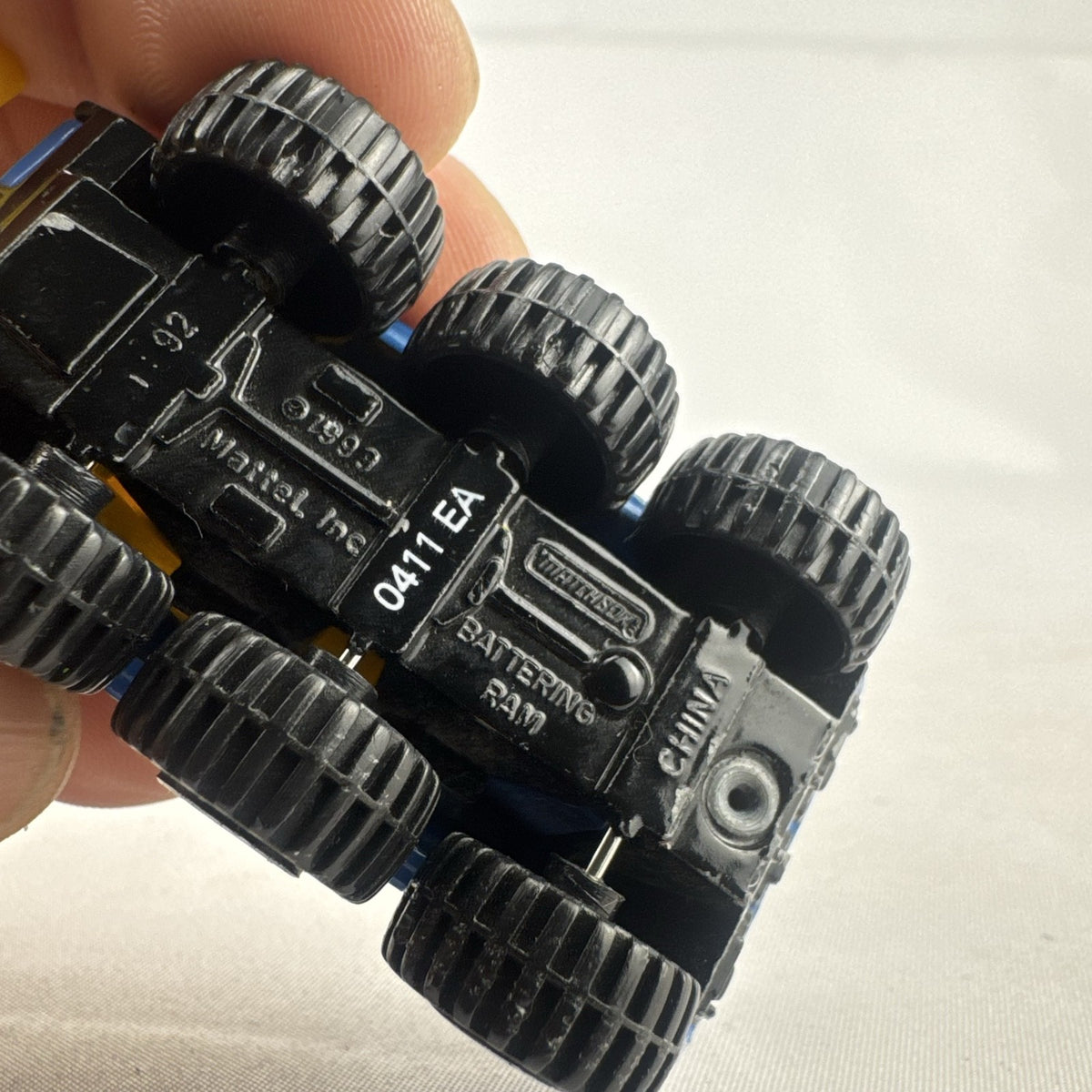 Vintage 1993 Matchbox Battering Ram blue diecast 6x6 police armored truck with rotating turret and front plow.