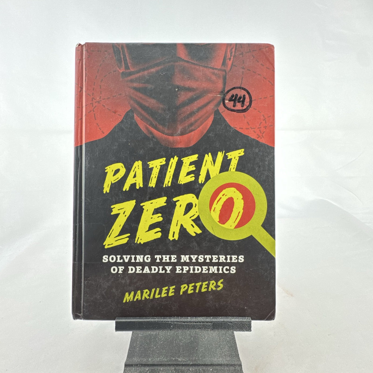 Front cover of Patient Zero: Solving the Mysteries of Deadly Epidemics hardcover book by Marilee Peters.