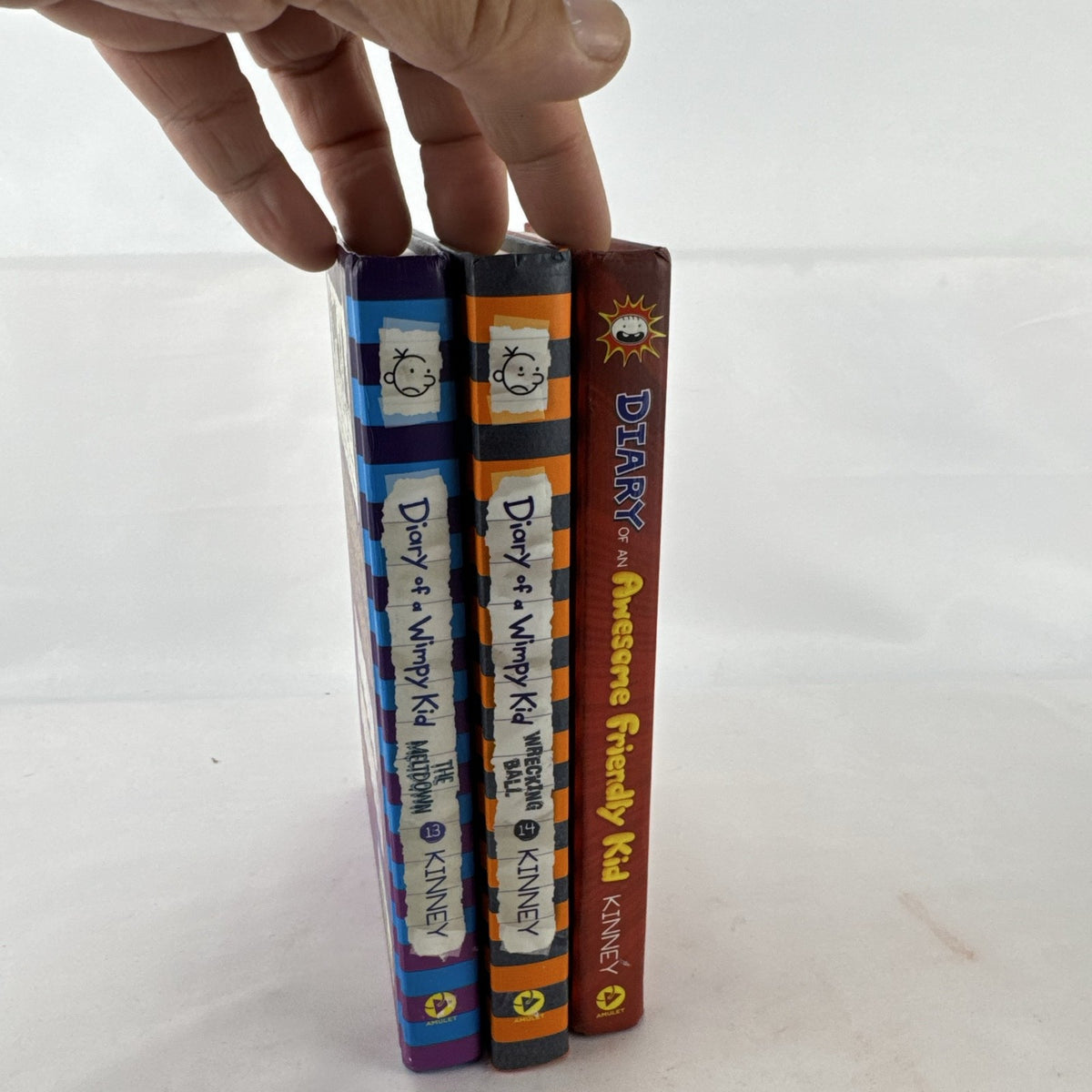 Set of three Jeff Kinney Diary of a Wimpy Kid hardcover books including The Meltdown and Wrecking Ball