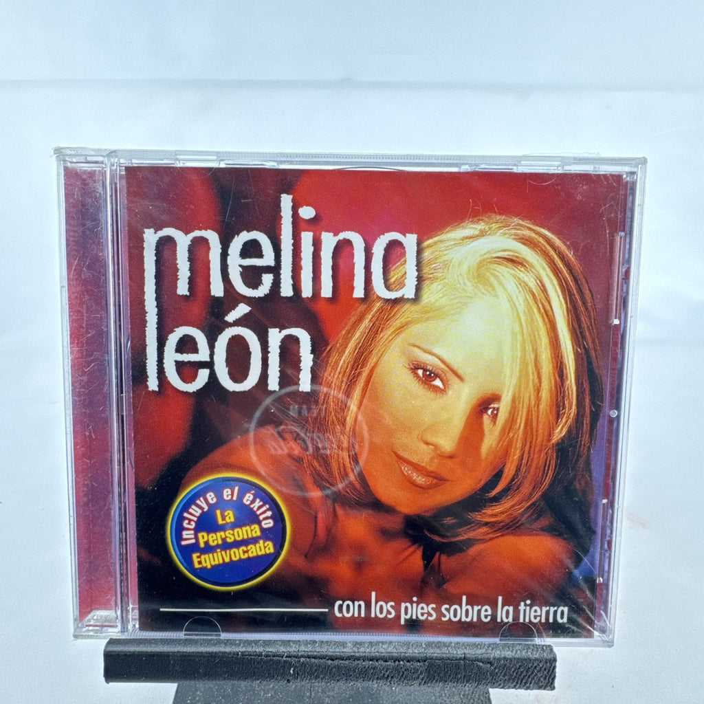 Factory-sealed 1999 CD album cover of Melina León's Con Los Pies Sobre La Tierra on Sony Discos